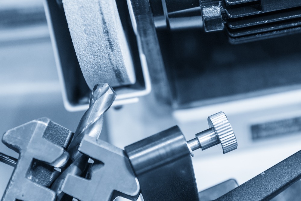 Close-up of a unique metallic key inserted into a lock, with intricate details visible.